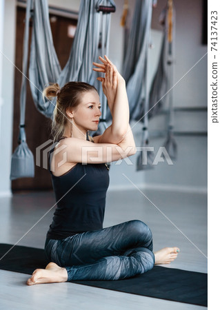 Muscular sporty lady posing with arms crossed Stock Photo by