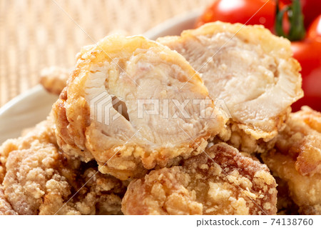 Cross section of fried chicken (fried chicken thigh). 74138760