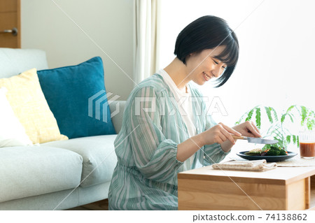 Woman eating vegetable food 74138862