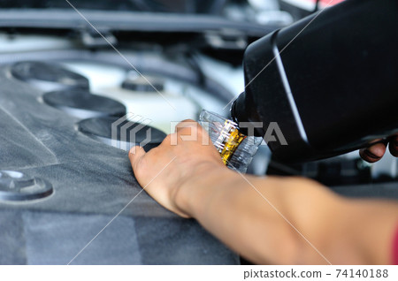 Add motor engine oil into vehicle 74140188