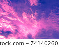 sky and clouds nature background,pink and purple light on soft clouds in overcast blue sky 74140260
