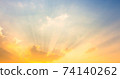 sky and clouds nature background,yellow sun light on sky with sun rays 74140262
