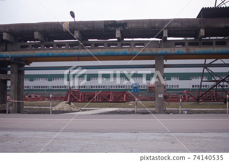 big pipes along the road. factory premises a big concern for iron ore industry. big pipes along the road. 74140535