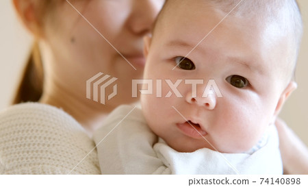 Baby smiling looking at the camera 74140898