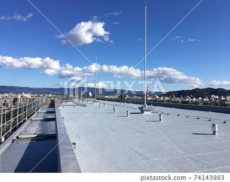 Rooftop of an apartment on a sunny day Rooftop of an apartment on a sunny day 74143983