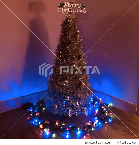 Christmas trees and lights create a warm holiday atmosphere Christmas trees and lights create a warm holiday atmosphere 74149170