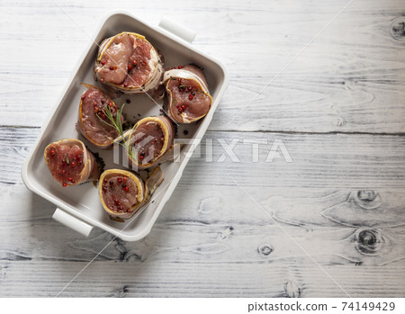 pork tenderloin in bacon on pepper pork tenderloin in bacon on pepper 74149429
