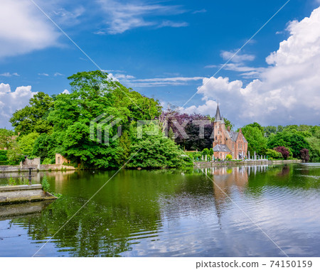 Bruges (Brugge) cityscape with Minnewater lake Bruges (Brugge) cityscape with Minnewater lake 74150159