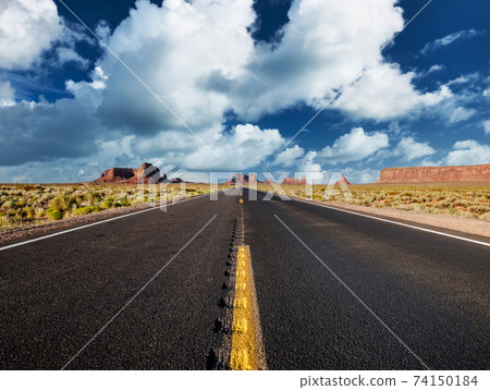 Empty scenic highway in Monument Valley Empty scenic highway in Monument Valley 74150184