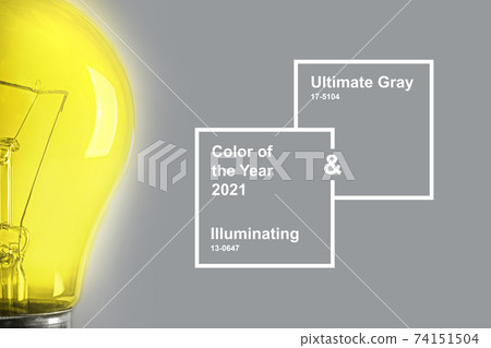 Half glowing light bulb on the gray background. Half glowing light bulb on the gray background. 74151504