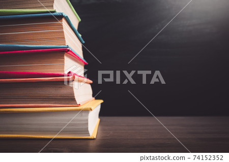 School accessories on the table with blackboard background School accessories on the table with blackboard background 74152352
