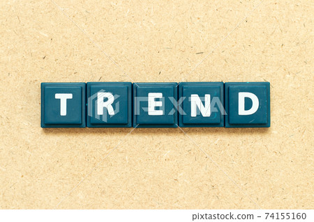 Tile alphabet letter in word trend on wood background 74155160