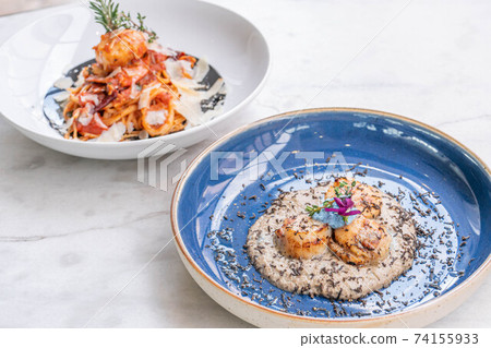 Seared scallop appetizer in dish Seared scallop appetizer in dish 74155933