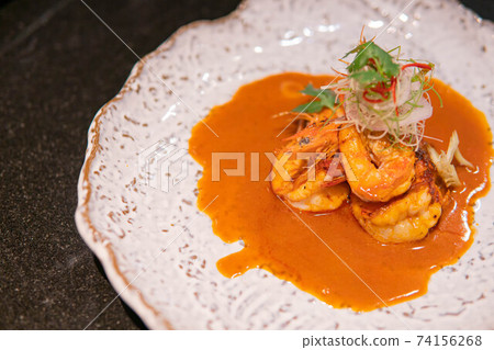 Indian spicy food shrimp curry prepared with coconut served as side dish 74156268