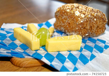 Cheese platter with cheese, bread and fruit 74158723