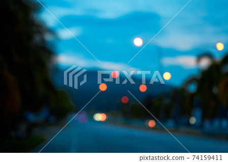 Unfocused image of sunset landscape view of a highway on a tropical island 74159411