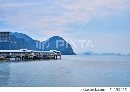 Covered boat pier. Transport boat port on a tropical island 74159455