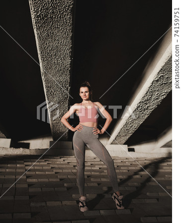 Sporty girl in sportswear outdoors Sporty girl in sportswear outdoors 74159751