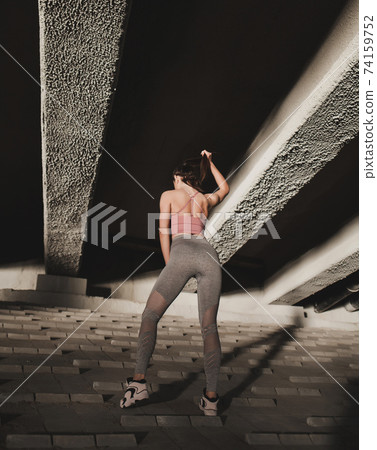 Athletic woman posing in sport wear Athletic woman posing in sport wear 74159752