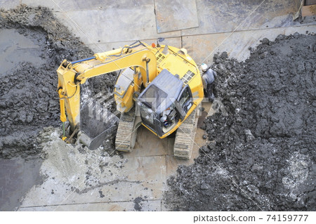 Construction site foundation work Carrying out earth and sand from excavation work 74159777