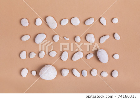 Summer concept with pebble and beach. Summer concept with pebble and beach. 74160315