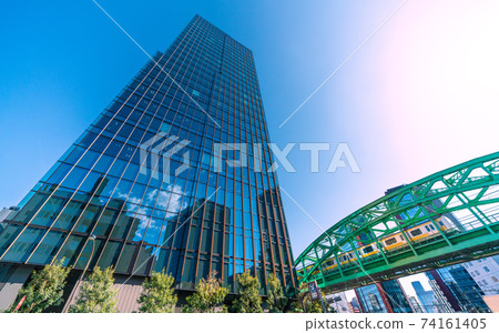 View of Tokyo cityscape of Japan, such as the Sobu Main Line Matsuzumicho Overpass and skyscrapers over the Shoheibashi intersection 74161405