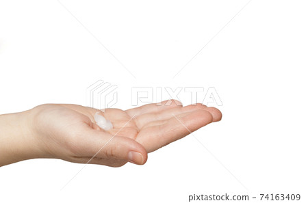 Female caucasian hand slightly bent palm with cream isolated on white background Female caucasian hand slightly bent palm with cream isolated on white background 74163409