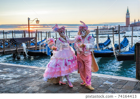 Colorful carnival masks at a traditional festival in Venice, Italy 74164413