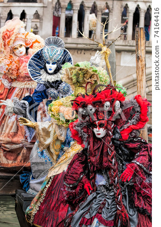 Colorful carnival masks at a traditional festival in Venice, Italy 74164416