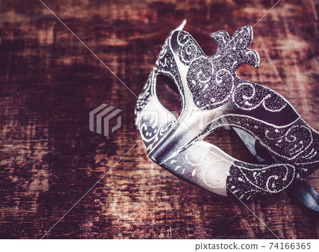 Vintage carnival mask. Preparing for the holidays Vintage carnival mask. Preparing for the holidays 74166365