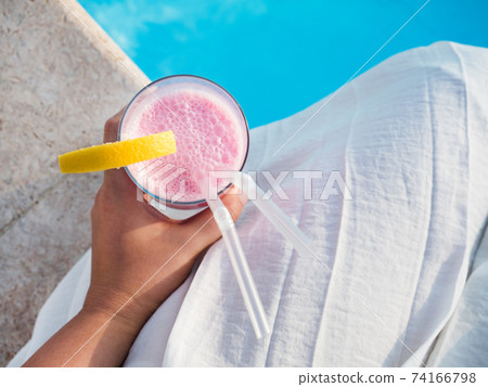 Glass with a beautiful milkshake. View from above Glass with a beautiful milkshake. View from above 74166798