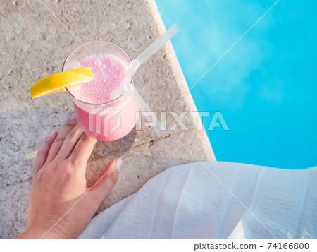 Glass with a beautiful milkshake. View from above Glass with a beautiful milkshake. View from above 74166800