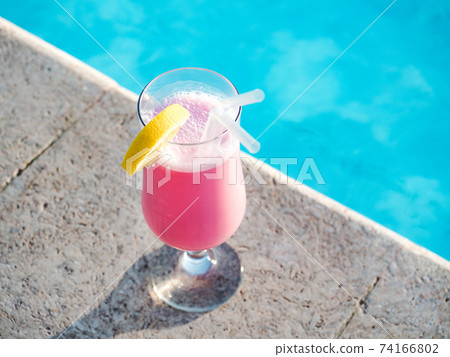 Glass with a beautiful milkshake. View from above Glass with a beautiful milkshake. View from above 74166802