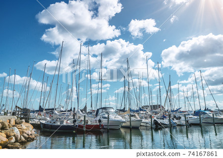 Sailing boats in a marine harbor in the summer 74167861