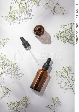 Herbal essential oils on white background, flat lay, top view 74168091