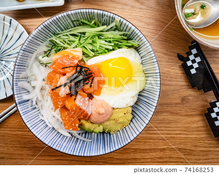 served bowl with bibimbap with salmon sashimi served bowl with bibimbap with salmon sashimi 74168253