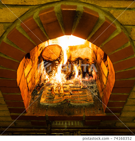 above view of brick fireplace with fire above view of brick fireplace with fire 74168352