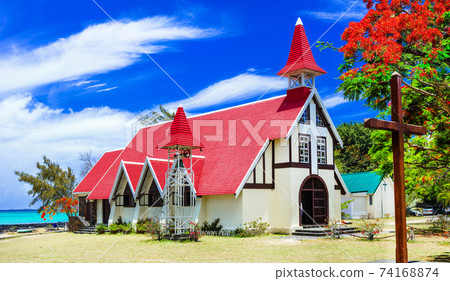 landmarks of  Mauritius island - Red church on the beach. Cap Malheureux 74168874