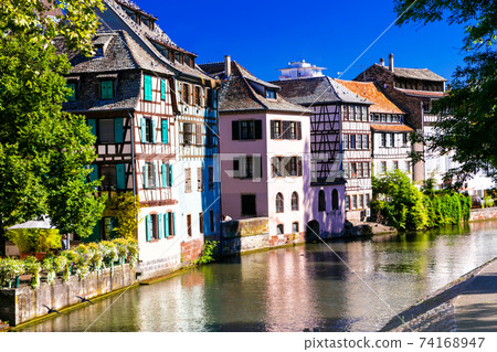 Romantic canals of Strasbourg with traditional half-timbered houses. France. Alsace Romantic canals of Strasbourg with traditional half-timbered houses. France. Alsace 74168947