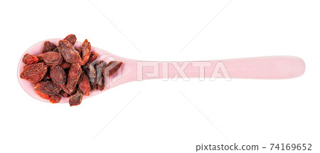 top view of ceramic spoon with dried goji berries 74169652