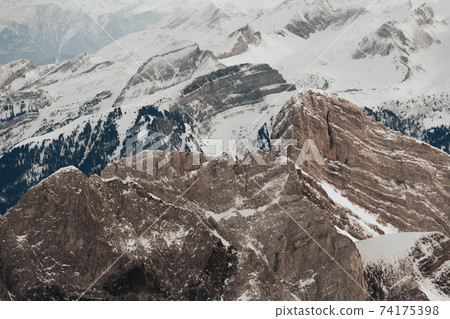 Snow covered swiss alps from above view of mountain Saentis Snow covered swiss alps from above view of mountain Saentis 74175398