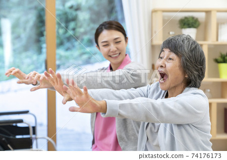 Recreational seniors and caregivers 74176173