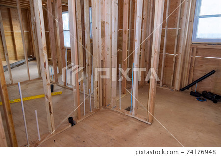 Wooden house frame structure on a new development Wooden house frame structure on a new development 74176948