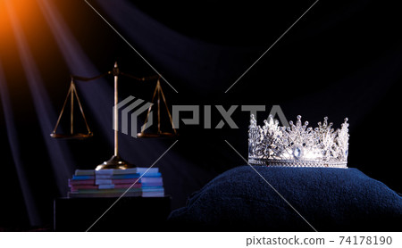 Diamond Crown of Miss Beauty Queen Pageant Contest and Bank Note Money and Scale Justice Balance are on Black Drape Background as ramp. Concept of Fairness in Pageant Contest Business, copy space 74178190