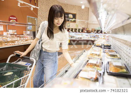 Young female customers buying side dishes at the supermarket Young female customers buying side dishes at the supermarket 74182321