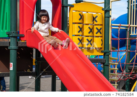 Children playing on the slide 74182584