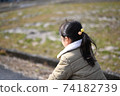 Back view of a girl outdoors 74182739