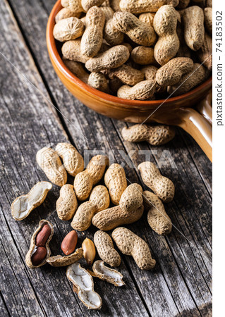 Roasted peanuts. Tasty groundnuts. 74183502
