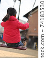 Back view of a girl on a swing 74183530