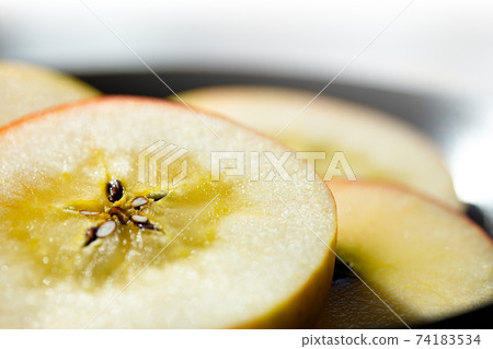 Sliced phantom apple (komitsu) Sliced phantom apple (komitsu) 74183534